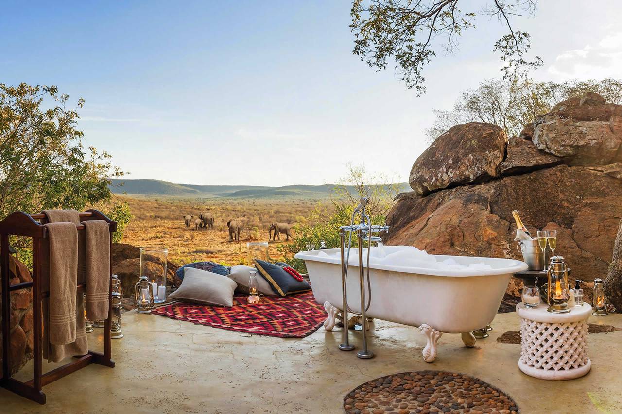 127737-aardvark-safaris-view-of-romantic-bath-overlooking-a-game-reserve